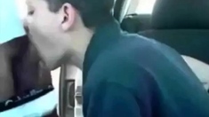 Sucking a cock seated in his car