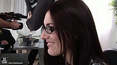 Admirable girl in glasses is tempted and fucked in the office room