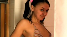 Teen Lily does some seductive posing and teases in the bathtub