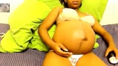 Heavily pregnant black cam chick