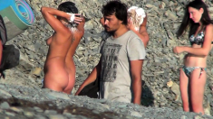 Voyeur video of a couple having intense sex at the beach