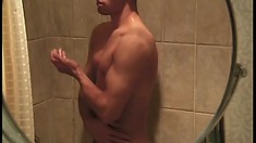 Cute gay stud takes a shower and strokes his long rod to pleasure